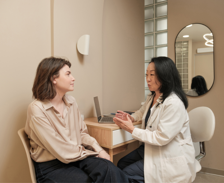 Two women sitting in an office having a consultation.