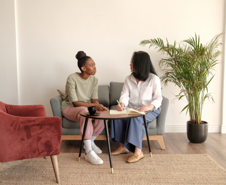 Two women engaged in conversation.